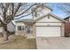 Charming two-story home featuring stone accents, a two-car garage, and a well-maintained front yard at 1663 W 135Th Way, Denver, CO 80234