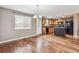 Eat in kitchen area with light wood cabinets, black appliances, and wood floors at 1663 W 135Th Way, Denver, CO 80234