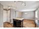 Open concept kitchen with an island, hardwood floors, and modern track lighting at 1663 W 135Th Way, Denver, CO 80234
