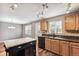 Kitchen area featuring an island, hardwood floors, and stainless steel sink at 1663 W 135Th Way, Denver, CO 80234