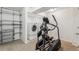 Inviting laundry room features modern washer and dryer, shelving and workout equipment at 1663 W 135Th Way, Denver, CO 80234