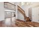 Bright living room boasts beautiful hardwood floors, a staircase, and an open floor plan at 1663 W 135Th Way, Denver, CO 80234