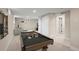 Finished basement with a pool table and a cozy lounge area, perfect for entertaining guests at 7496 Clay St, Westminster, CO 80030