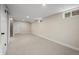 Spacious basement featuring a large storage closet and a secondary door to a stairwell at 7496 Clay St, Westminster, CO 80030
