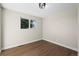 Empty bedroom with hardwood floors, a window, and neutral paint, offering a blank canvas at 7496 Clay St, Westminster, CO 80030
