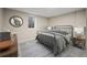 Cozy bedroom with soft lighting and a window, showcasing a comfortable metal frame bed and decor at 7496 Clay St, Westminster, CO 80030
