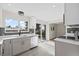 Bright kitchen with stainless appliances, gray cabinets, and modern subway tile backsplash at 7496 Clay St, Westminster, CO 80030