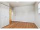 Bedroom with hardwood flooring and an ample closet at 7412 W 76Th Ave, Arvada, CO 80003