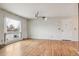 Spacious living room with hardwood floors and a large window for natural light at 7412 W 76Th Ave, Arvada, CO 80003