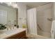 A fully remodeled bathroom features a shower and tub combo with decorative tile walls at 9172 W 88Th Cir, Westminster, CO 80021