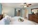 Inviting bedroom boasts a patio door, dresser, and ceiling fan for added comfort and style at 9172 W 88Th Cir, Westminster, CO 80021