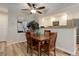 Cozy dining area adjacent to the kitchen, featuring a wooden table and stylish decor at 9172 W 88Th Cir, Westminster, CO 80021