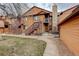 Exterior elevation showcasing multiple units, green space, stairs and walkways at 9172 W 88Th Cir, Westminster, CO 80021