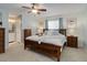 Serene main bedroom boasts a ceiling fan, natural light, and en-suite bath access at 9172 W 88Th Cir, Westminster, CO 80021
