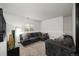 Cozy basement featuring plush seating, a comfortable sectional sofa, and neutral carpeting at 1415 S Chambers #106 Rd, Aurora, CO 80017
