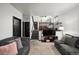 Basement featuring a cozy Gathering room with a large TV, comfortable seating, and a staircase at 1415 S Chambers #106 Rd, Aurora, CO 80017