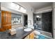 Modern bathroom with a glass-enclosed shower, updated vanity, and sleek tile work at 1415 S Chambers #106 Rd, Aurora, CO 80017