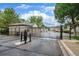 Gated community entrance with a security system and well-manicured landscaping at 1415 S Chambers #106 Rd, Aurora, CO 80017