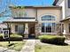 Charming home featuring stone accents, a well-manicured lawn, and ample natural light from large windows at 1415 S Chambers #106 Rd, Aurora, CO 80017