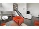 Bright living room with high ceilings, modern decor, and a staircase leading to the upper level at 1415 S Chambers #106 Rd, Aurora, CO 80017