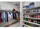 Organized walk-in closet with ample shelving and hanging space for clothes and shoes at 1415 S Chambers #106 Rd, Aurora, CO 80017
