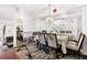 Elegant dining room with large mirror, ornate chandelier, and seating for eight is perfect for entertaining at 1885 S Quebec Way # G104, Denver, CO 80231