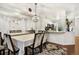 Elegant dining room with large mirror, ornate chandelier, and seating for eight is perfect for entertaining at 1885 S Quebec Way # G104, Denver, CO 80231