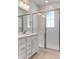 Bathroom with a double vanity, sleek shower and modern fixtures at 16794 W 94Th Way, Arvada, CO 80007