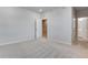 A bedroom featuring an open closet and bathroom entrance at 16794 W 94Th Way, Arvada, CO 80007
