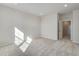 Bright bedroom with carpet, natural light, and open door to another room at 16794 W 94Th Way, Arvada, CO 80007