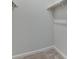 An open closet with shelving units and carpet at 16794 W 94Th Way, Arvada, CO 80007