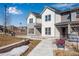 Attractive townhomes feature bright exteriors, modern design, and inviting walkways for community living at 16794 W 94Th Way, Arvada, CO 80007