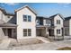 New townhome showcasing a neutral color palette, well-maintained walkway, and contemporary architectural design at 16794 W 94Th Way, Arvada, CO 80007