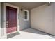 Inviting front porch with stylish front door, house numbers and Tri Pointe Homes doormat at 16794 W 94Th Way, Arvada, CO 80007