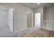 Spacious hallway area with carpet flooring and several doors leading to other rooms at 16794 W 94Th Way, Arvada, CO 80007