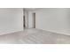 An open room with carpet flooring and neutral walls showing electrical outlets at 16794 W 94Th Way, Arvada, CO 80007