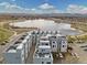 Stunning aerial view of the residential property, nearby lake, and mountain views at 3101 W 47Th Ave # 14, Denver, CO 80211