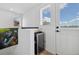 Entertainment area featuring a beverage cooler, bar top, and a modern design with natural light at 3101 W 47Th Ave # 14, Denver, CO 80211