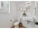 Bright bathroom featuring a floating vanity and a modern, open-concept design with tiled floors at 3101 W 47Th Ave # 14, Denver, CO 80211
