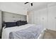 Comfortable main bedroom with a plush bed, gray headboard, and modern white wardrobe at 3101 W 47Th Ave # 14, Denver, CO 80211