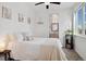 Bright bedroom featuring a large window and an ensuite bathroom at 3101 W 47Th Ave # 14, Denver, CO 80211