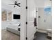 Stylish bedroom featuring a private bathroom with a glass-enclosed shower and black accents at 3101 W 47Th Ave # 14, Denver, CO 80211