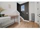 Inviting entryway with a modern console table, black accent wall, and natural wood flooring at 3101 W 47Th Ave # 14, Denver, CO 80211
