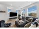 Bright living room featuring large windows, a comfortable couch, and modern decor at 3101 W 47Th Ave # 14, Denver, CO 80211