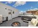 Cozy rooftop deck featuring a hot tub, barbecue, and fire pit with gray tiling and a door at 3101 W 47Th Ave # 14, Denver, CO 80211