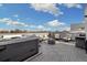 Rooftop deck with a hot tub, seating, a grill, and stunning city views at 3101 W 47Th Ave # 14, Denver, CO 80211