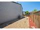 Backyard featuring wood fence, an air conditioner and low maintenance gravel landscaping at 9125 Lowell Ct, Westminster, CO 80031