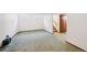 Spacious basement area with large windows, carpet and access to the stairwell at 9125 Lowell Ct, Westminster, CO 80031