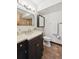 Chic bathroom featuring a modern vanity, tile flooring, and a well-lit mirror at 9125 Lowell Ct, Westminster, CO 80031