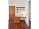 Cozy desk area with wooden desk, drawers, and shelves, perfect for a home office space at 9125 Lowell Ct, Westminster, CO 80031